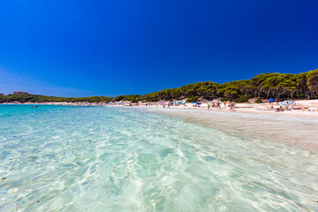 CALA AGULLA, MALLORCA, SPAIN - 21 July 2020: People enjoying summer on the popular beach on Mallorca,  Balearic Islands.