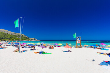 CALA AGULLA, MALLORCA, SPAIN - 21 July 2020: People enjoying summer on the popular beach on Mallorca,  Balearic Islands.