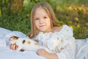 Little girl with kitten