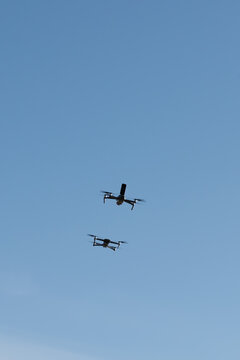 Two drones racing in the sky.