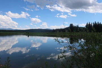 Reflective lake water in Tetons National Park in Wyoming