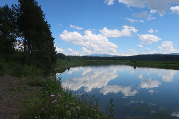 Reflective lake water in Tetons National Park in Wyoming
