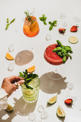Popular bar summer ice alcoholic cocktails. Gin-tonic, Aperol Spritz and strawberry basil Margarita...