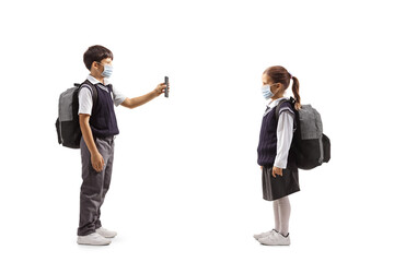 Boy showing a smartphone to a girl with face masks