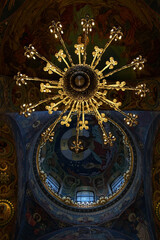 Chandelier and ceiling mosaics in orthodox Church of the Savior temple, Saint Petersburg, Russia