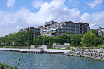 Fototapeta na wymiar Waterfront trail beside Lake Ontario, near Toronto, with apartment buildings