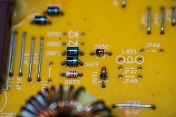 A microcircuit with transistors, resistors, capacitors, coils, contacts on an electronic board in...