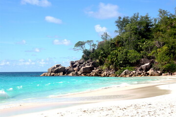 Beautiful paradise beach in Seychelles Island with white sand beach, turquoise blue water, green vegetation and granit rocks,  Seychelles. La Digue, Mahe, Praslin.