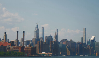 landscape of manhattan midtown NYC with east river at daytime