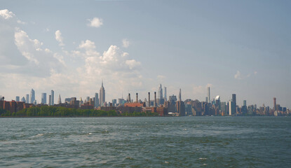 landscape of manhattan midtown NYC with east river at daytime