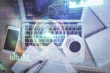 Multi exposure of data theme drawing hologram over topview work desk background with computer. Concept of technology.