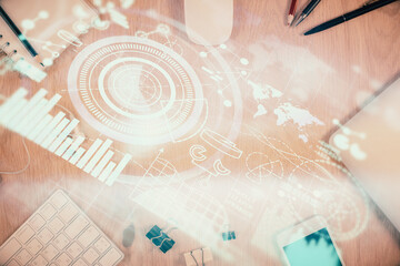 Double exposure of business theme hologram over desktop with phone. Top view. Mobile international trade connection concept.