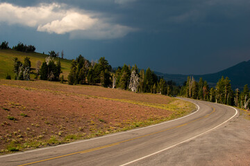 Dark and stormy sky along road in Crater Lake National Park.