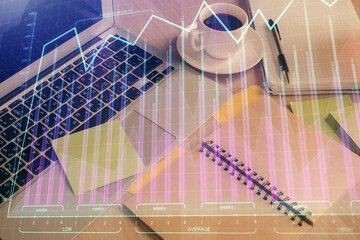 Multi exposure of forex graph drawing and desktop with coffee and items on table background. Concept of financial market trading