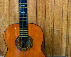 Fototapeta premium guitar on a wooden background