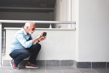 Engineer photographing using mobile phone at building site