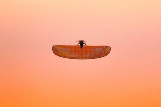 Paramotor Flying on sky.