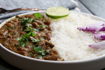 A platter of Indian red Kidney beans curry or Rajma Masala and rice