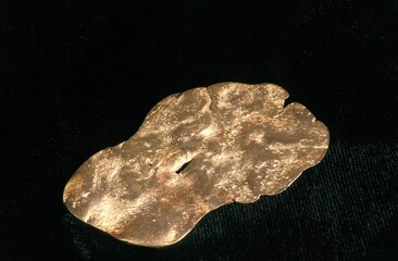 COPPER AGAINST BLACK BACKGROUND