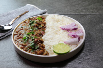 A platter of Indian red Kidney beans curry or Rajma Masala and rice