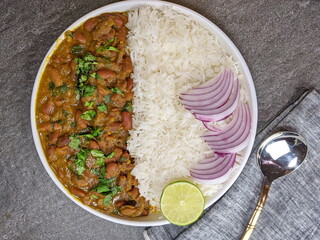 A platter of Indian red Kidney beans curry or Rajma Masala and rice