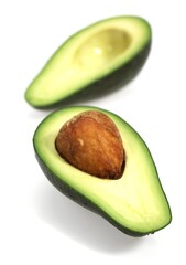 AVOCADO AGAINST WHITE BACKGROUND