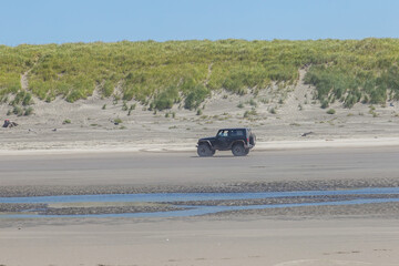 Off road vehicle driving on the beach