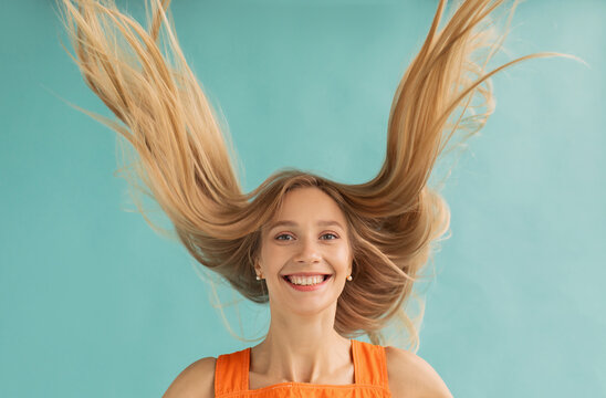 Cheerful female with flying fair hair
