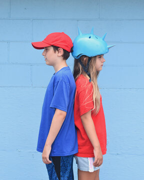 Children Standing Back to Back