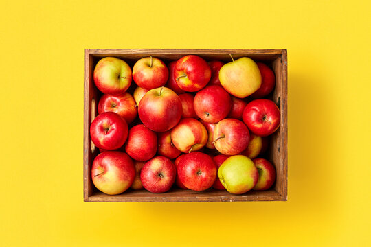 Box with fresh organic apples.