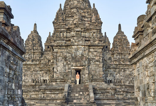 Woman at the gate of an ancient temple in Prambanan Temple, Java, Indonesia
