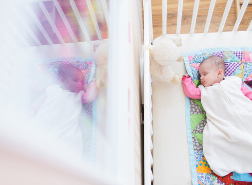 view of sleeping baby in crib