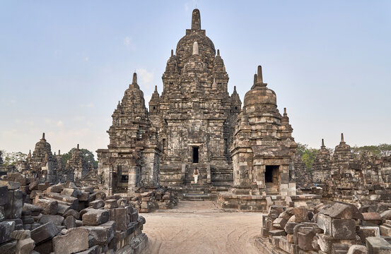 Woman with backpack standing in front of the gate in Prambanan Temple, Java, Indonesia.
