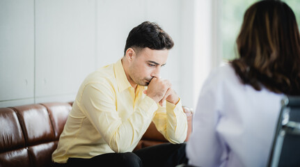 Close-up of psychologist comforting his depressed patient, mental health concept