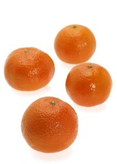 CLEMENTINE FRUIT citrus reticulata AGAINST WHITE BACKGROUND