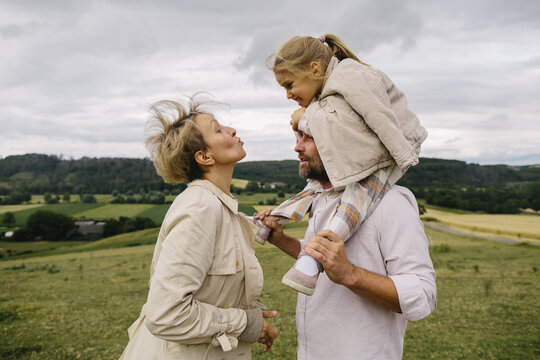 Mom, dad and little girl