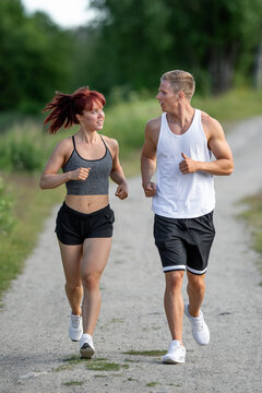 young fit couple running