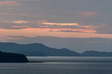 Beautiful first light from sunrise on island mountain with color sky 