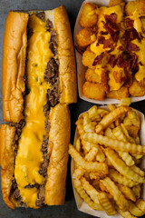 Cheesesteak with French fries and tater tots