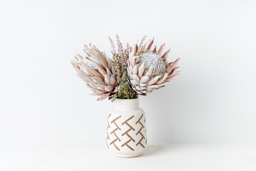 Beautiful floral arrangement including beautiful dried pink King Proteas and delicate thryptomene...