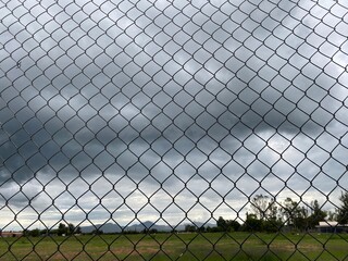 chain link fence with barbed wire