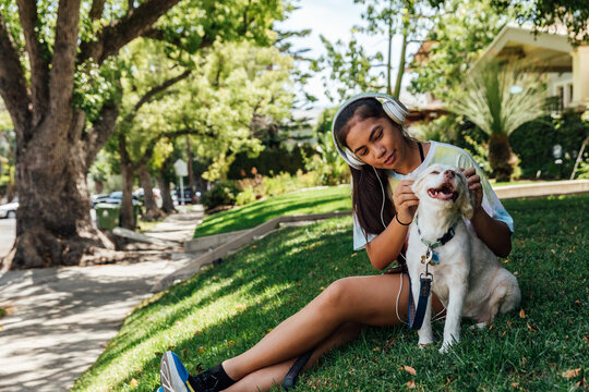 Teenage Girl Pets Dog
