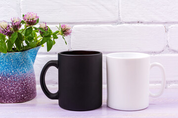 White and black mug mockup with pink clover