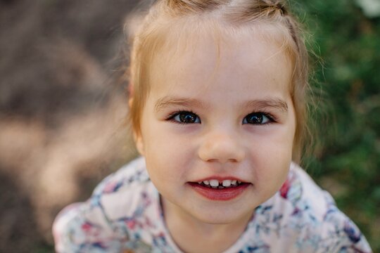 Adorable little beautiful girl smiling at camera