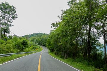 Rural Country Road on the Mountains early in the morning on the Doi Phuka National Reserved Park, Nan Province, Thailand