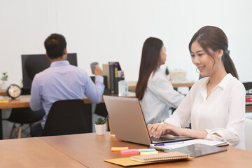 Fototapeta na wymiar Business asian woman happy working job on laptop in office.
