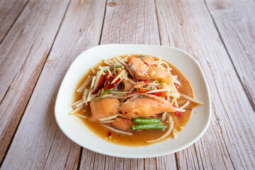 Close up of Spicy Papaya Salad with Salmon.