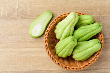Chayote squash or Mirlition squash in basket, Organic vegetable, Edible plant fruit