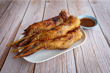 Grilled chicken wings on dish