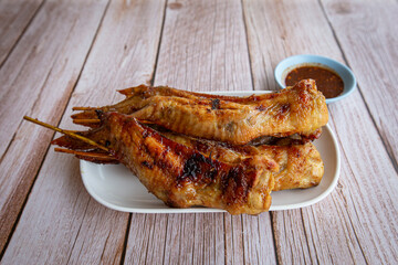 Grilled chicken wings on dish